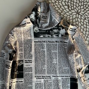 BALENCIAGA
Newspaper Print Stretch Trutleneck Top In White/black
